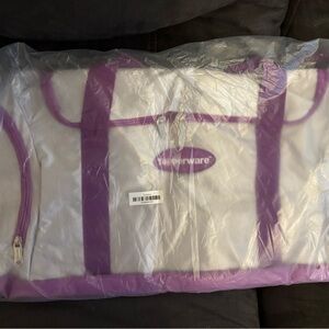 Tupperware silver tote with purple handle 
.